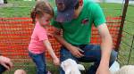 My granddaughter with lambs