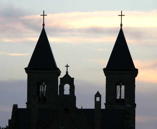 Sun setting behind the towers of the Cathedral of the Plains
