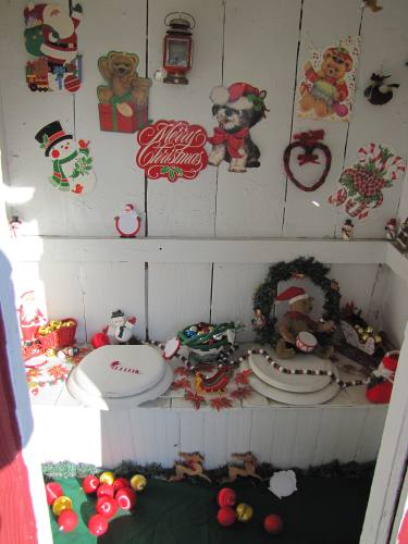 outhouse decorated for Christmas