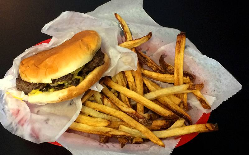 cheese burger with fries at Smitty's Carry Out