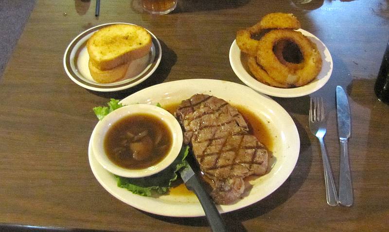 rib eye steak and onion rings